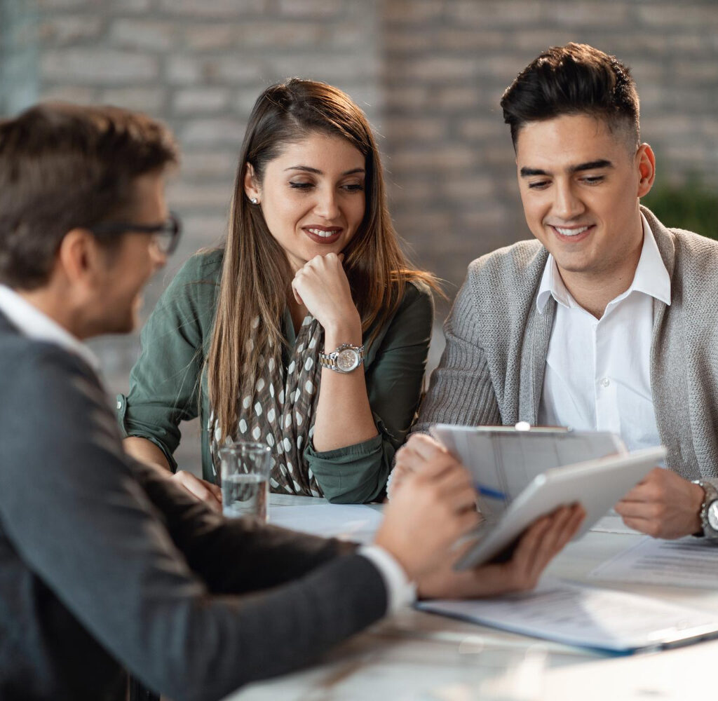 young-happy-couple-having-consultations-with-bank-manager-meeting-office